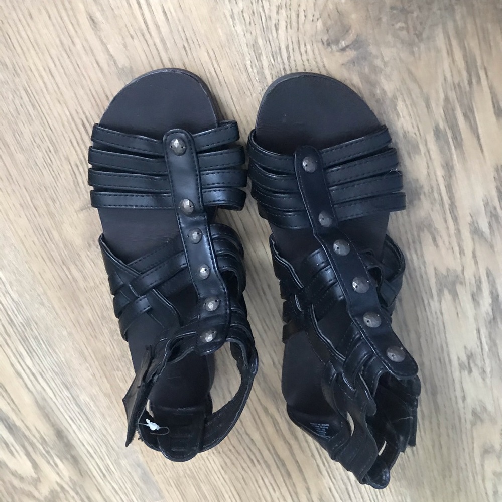 Black gladiator sandals with Velcro straps on side
